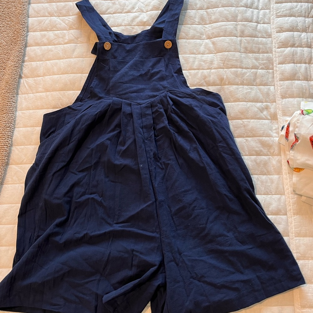 Never worn blue overalls with wooden buttons